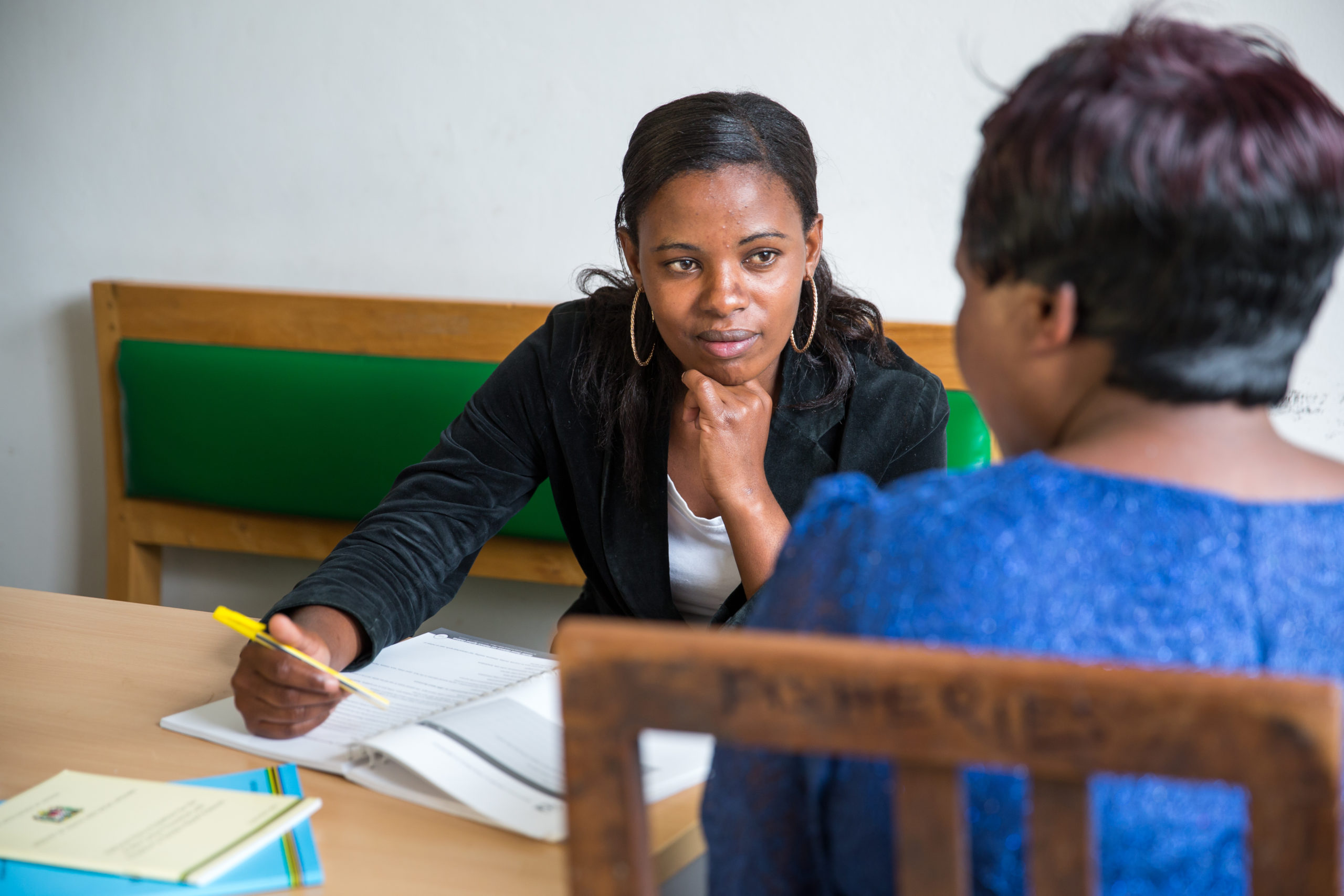 A social welfare officer speaks with client.