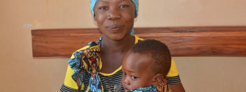 Smiling mother with baby.