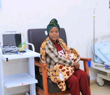 Photo of Misgana, a mother in Ethiopia, holding her premature baby at the kangaroo mother care facility at her hospital.